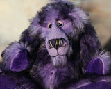 Griswald Grooch is made from a straight pile, medium length, black-tipped purple mohair that on a little bear seems quite long and fluffy. Griswald has purple velvet paw pads which complement his mohair beautifully and have a slight sparkle.  Griswald Grooch has beautiful, hand painted eyes with hand coloured eyelids, a splendid little nose embroidered from individual threads to match his colouring and he has a sweet, friendly expression