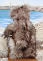 Grizzly George Gruffletruffle is a wild and wonderful, one of a kind, artist teddy bear in gorgeous faux fur & mohair by Barbara-Ann Bears Grizzly George Gruffletruffle is quite a large teddy bear, he stands 18 inches (46 cm) tall and is 14.5 inches (37 cm) sitting. Grizzly George Gruffletruffle is a big, heavy bear with a very dignified and relaxed manner