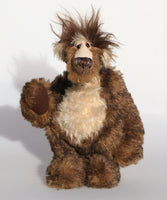Grooble Grufflebelly is made from the most gorgeous and luxurious mohairs, mainly a deep and dense, medium brown mohair with black tipping, the top of his snout, tummy, the fronts of his ears and the underside of his tail are a long, fluffy and tousled pale stone coloured mohair and on top of his head he has a mop of very long dark brown mohair. Grooble has dark brown German wool felt paw pads that complement his mohair perfectly