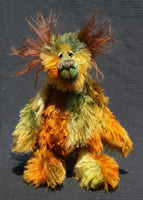 Grunyan is a very happy and beautifully coloured teddy bear, a one of a kind, hand dyed mohair artist bear by Barbara-Ann Bears, he stands 9.5 inches (24 cm) tall and is 7.5 inches ( 19 cm) sitting.  Grunyan is a mixture of beautiful natural colours, the colours of a cool, dark forest where the elk and the bears roam.