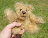 Gubbins is a very sweet little artist bear in wildly curly mohair by Barbara-Ann Bears Gubbins stands just 6.5 inches(17 cm) tall and is 5 inches (12.5 cm) sitting. He has a warm beaming smile which gives him that very sweet 'please pick me up and love me' expression