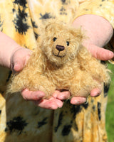 Gubbins is a very sweet little artist bear in wildly curly mohair by Barbara-Ann Bears  Gubbins stands just 6.5 inches(17 cm) tall and is 5 inches (12.5 cm) sitting. He has  a warm beaming smile which gives him that very sweet 'please pick me up and love me' expression