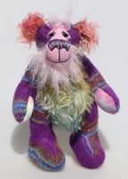 Harry Huckleberry is a colourful and exotic, one of a kind, artist bear by Barbara-Ann Bears in luxurious mohair and upcycled Peruvian wool fabric. He stands 15 inches (38 cm) tall and is 12 inches (30 cm) sitting.  Harry Huckleberry is a wonderful, colourful teddy bear although, he was once a little Peruvian jacket 