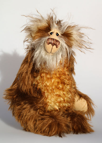 Harvey Nutbundler, an appealingly wild and friendly one of a kind artist teddy bear in stunning mohair by Barbara-Ann Bears Harvey Nutbundler stands 12.5 inches (31 cm) tall and is 9.5 inches (24 cm) sitting. Harvey Nutbundler is a sweet, handsome bear, a bear who can be seen wandering through open woodland collecting nuts and berries