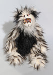 Hollywood is a wildly fluffy, comical and handsome one of a kind artist teddy bear in gorgeous mohair and faux fur by Barbara Ann Bears Hollywood stands 14.5 inches( 37 cm) tall and is 11.5 inches (29 cm) sitting. Hollywood is a striking bear, primarily a black and white teddy but with little splashes of vibrant colour