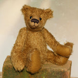 Homer is a charming, traditional one of a kind artist bear in German mohair by Barbara Ann Bears, he stands 10 inches/27 cm tall and is 7.5 inches/22 cm sitting. Homer is made from beautiful, slightly distressed, brown German mohair with a hint of khaki, matching wool-felt paw pads and vintage boot buttons for eyes