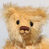 Honeynut is a lovely bear, he has the sweetest, most loving expression. He has old boot buttons for eyes, a pert, little, carefully embroidered brown nose and the sweetest smile.