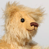 Honeynut is a lovely bear, he has the sweetest, most loving expression. He has old boot buttons for eyes, a pert, little, carefully embroidered brown nose and the sweetest smile.