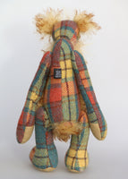 Howard Huckleford is an engagingly eccentric one of a kind artist bear in elegant tweed and wildly fluffy tipped mohair by Barbara Ann Bears He stands 14.5 inches( 37 cm) tall and is 11 inches (28 cm) sitting. Howard Huckleford is made from a beautifully coloured Harris Tweed and long, fluffy brown tipped blonde mohair