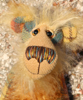 Howard Huckleford is made from a beautifully coloured Harris Tweed and a long, fluffy brown tipped blonde mohair with beige German wool felt paw pads  Howard Huckleford has large, beautiful, hand painted glass eyes (painted to match his colours) with hand coloured eyelids, an impressive nose embroidered from individual threads to match his colouring and a beaming smile