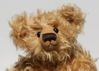 Humphrey is quite a large, classical teddy bear, he stands 18 inches (46cm) tall and is 13 inches (33cm) sitting. Humphrey is little bit wild to be a proper traditional teddy bear and he likes it that way. Humphrey is made from the most gorgeous long and wavy, dusky blond German mohair which comes to life in sunshine