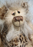 Hywel is a very sweet one of a kind, artist bear by Barbara-Ann Bears in wonderfully fluffy mohair and faux fur Hywel stands 9.5 inches (24 cm) tall and is 7 inches (18 cm) sitting. He is made in long, soft, brown-tipped cream faux fur, his face and the backs of his ears are a very long and fluffy pale cream mohair 