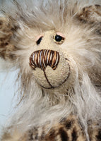 Hywel is a very sweet one of a kind, artist bear by Barbara-Ann Bears in wonderfully fluffy mohair and faux fur Hywel stands 9.5 inches (24 cm) tall and is 7 inches (18 cm) sitting. He is made in long, soft, brown-tipped cream faux fur, his face and the backs of his ears are a very long and fluffy pale cream mohair 