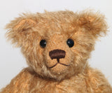 Jack is made from beautiful, slightly distressed antique gold German mohair, he has brown wool-felt paw pads and vintage boot buttons for eyes. He has a carefully embroidered little nose and the sweetest smile