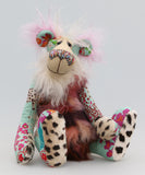 Jackie O'Kapi is a kooky, funky and funny one of a kind artist bear in printed cotton, mohair and faux fur by Barbara Ann Bears, he stands 14.5 inches( 37 cm) tall and is 11.5 inches (29 cm) sitting. Jackie O'Kapi is quite a gangly, comical bear, he's a bear who wants to see you smiling and even laughing.