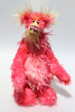 Mr Jazzicle, a gorgeous, kooky and gloriously pink, a one of a kind artist bear in stunning hand dyed mohair by Barbara-Ann Bears. He stands 15 inches( 37 cm) tall and is 11.5 inches ( 29 cm) sitting, mostly made from a long, wildly distressed mohair that Barbara has dyed in a gorgeous blend of magenta and softer pinks