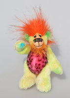 Jeremiah Jitterbug is a joyous celebration of colourful happiness, a one of a kind, hand dyed mohair and faux fur artist bear by Barbara-Ann Bears, he stands 6.5 inches/ 16 cm tall and is 5 inches/ 13 cm sitting. He's a very colourful bear in yellow, pink and orange who loves to see you smile