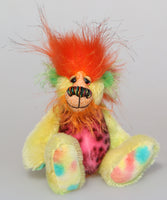 Jeremiah Jitterbug is a joyous celebration of colourful happiness, a one of a kind, hand dyed mohair and faux fur artist bear by Barbara-Ann Bears, he stands 6.5 inches/ 16 cm tall and is 5 inches/ 13 cm sitting. He's a very colourful bear in yellow, pink and orange who loves to see you smile