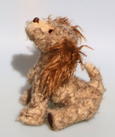 Jessie is a friendly and appealingly scruffy, artist teddy dog made in beautiful German mohair by Barbara Ann Bears. Jessie stands 10.5 inches( 26 cm) tall, she is 12 inches (31 cm) from nose to the base of her tail and she is 10.5 inches (26 cm) across the ears.