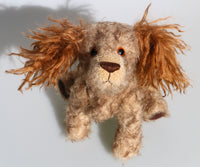 Jessie is a friendly and appealingly scruffy, artist teddy dog made in beautiful German mohair by Barbara Ann Bears. Jessie stands 10.5 inches( 26 cm) tall, she is 12 inches (31 cm) from nose to the base of her tail and she is 10.5 inches (26 cm) across the ears.