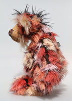 King Konk is an exotic, fun-loving and comical, one of a kind, artist bear by Barbara-Ann Bears in long mohair and rather wild faux fur. He stands 16 inches (40 cm) tall and is 12 inches (30 cm) sitting. King Konk is made from the most gorgeous and luxurious long faux fur, it looks like a patchwork but is one piece of fabric, areas of rose, cream, peach and pink are outlined in black