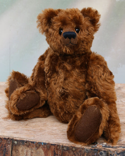 Kipling is a very sweet and cuddly, one of a kind, traditional artist teddy bear by Barbara Ann Bears, he stands 13 inches/33cm tall and is 10 inches/25 cm sitting. Kipling is made from a beautiful, slightly distressed German mohair which is the colour of the most delicious chocolate, he has matching wool-felt paw pads