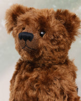 Kipling is a very sweet and cuddly, one of a kind, traditional artist teddy bear by Barbara Ann Bears, he stands 13 inches/33cm tall and is 10 inches/25 cm sitting. Kipling is made from a beautiful, slightly distressed German mohair which is the colour of the most delicious chocolate, he has matching wool-felt paw pads
