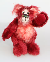 Krimbly Twinkles is a very happy little teddy bear, a one of a kind, mohair artist bear by Barbara-Ann Bears. he stands just 6.5 inches/16 tall and is 5 inches/13 cm sitting.  Krimbly Twinkles is a very happy and festive little bear mostly made from a medium length, mohair in a beautiful deep cherry red,