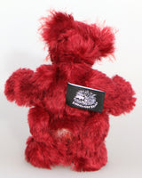Krimbly Twinkles is a very happy little teddy bear, a one of a kind, mohair artist bear by Barbara-Ann Bears. he stands just 6.5 inches/16 tall and is 5 inches/13 cm sitting.  Krimbly Twinkles is a very happy and festive little bear mostly made from a medium length, mohair in a beautiful deep cherry red,