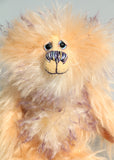 Lady Mathilda Moon-Muffin a one of a kind mohair artist bear by Barbara-Ann Bears, she stands 9 inches(23 cm) tall and is 6.5 inches ( 16 cm) sitting. Made from a long, fluffy, peachy-beige mohair with her face, tummy, the backs of her ears and the underside of her tail are a long, fluffy violet-tipped cream mohair