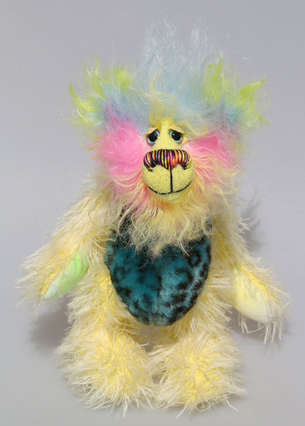 Leo Fuzzball is a joyous celebration of colourful happiness, a one of a kind, hand dyed mohair and faux fur artist bear by Barbara-Ann Bears, he stands 8.5 inches/21 cm tall and is 6.5 inches/16 cm sitting. Leo Fuzzball, a bear full of sunshine and happiness with the warm colours of summer to carry you through winter