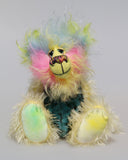 Leo Fuzzball is a joyous celebration of colourful happiness, a one of a kind, hand dyed mohair and faux fur artist bear by Barbara-Ann Bears, he stands 8.5 inches/21 cm tall and is 6.5 inches/16 cm sitting.  Leo Fuzzball, a bear full of sunshine and happiness with the warm colours of summer to carry you through winter