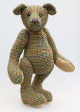 Lewis is a an elegant and refined traditional Barbara Ann Bear,he stands 17 inches (43cm) tall and is 12 inches (30cm) sitting. Lewis is made from a beautiful strong tweed, it's a check pattern in beige, olive green, cinnamon, navy blue and antique gold, with dull khaki wool felt paw pads