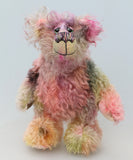 Lonnie Puckleton is an endearingly sweet and gentle, beautifully coloured, one of a kind hand dyed mohair artist bear by Barbara-Ann Bears, he stands 10 inches/25 cm tall and is 7.5 inches/18 cm sitting.  Lonnie's mohair is hand dyed with splashes of emerald, dusky rose, slate grey, peach, deep purple, blonde and lilac
