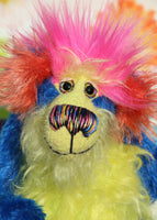 Ludo is a wild and wonderful celebration of colourful happiness, a one of a kind, hand dyed mohair artist bear by Barbara-Ann Bears, he stands 9.5 inches( 24 cm) tall and is 7.5 inches ( 19 cm) sitting. He's mostly a medium length distressed, intensely blue mohair with lime green, yellow, orange and pink features