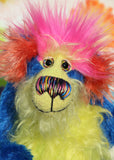 Ludo is a wild and wonderful celebration of colourful happiness, a one of a kind, hand dyed mohair artist bear by Barbara-Ann Bears, he stands 9.5 inches( 24 cm) tall and is 7.5 inches ( 19 cm) sitting. He's mostly a medium length distressed, intensely blue mohair with lime green, yellow, orange and pink features