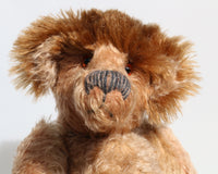 Ludwyn has amber translucent glass eyes (proper teddy bear eyes) and an impressive nose meticulously embroidered from two types of wool