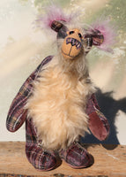 Maevis is a rather refined, loving and gentile one of a kind moahir artist bear by Barbara Ann Bears, she stands 15 inches( 38 cm) tall and is 12 inches (30 cm) sitting. Maevis is  from a beautiful 'tweedy' tartan in mauve, purple, gold, white, cream and grey, contrasted with a very long and soft wavy beige mohair. 