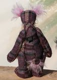 Maevis is a rather refined, loving and gentile one of a kind moahir artist bear by Barbara Ann Bears, she stands 15 inches( 38 cm) tall and is 12 inches (30 cm) sitting. Maevis is  from a beautiful 'tweedy' tartan in mauve, purple, gold, white, cream and grey, contrasted with a very long and soft wavy beige mohair. 