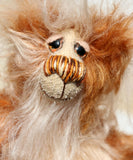 Magnus is a little, endearingly sweet and joyful, one of a kind, artist bear by Barbara-Ann Bears in wonderful batik and very fluffy mohair Magnus stands just 6.5 inches (16.5 cm) tall and is 5 inches (13 cm) sitting. Magnus is a joyful and sweet teddy bear, full of happy smiles and long tender cuddles