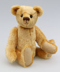 Mr. Makepeace is a charming and traditional mohair artist bear by Barbara Ann Bears of the same design as the one we made for Downton Abbey Mr. Makepeace stands 11 inches/28 cm tall and is 8 inches/21 cm sitting. Mr. Makepeace is a very well proportioned traditional teddy bear, he's not too stuffy, he's a friendly chap with a warm and loving expression