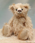 Matthew is a charming and traditional mohair artist bear by Barbara Ann Bears of the same design as the teddy bear we made for Downton Abbey.  He stands 10.5 inches/27 cm tall and is 8.5 inches/22 cm sitting and is made from  beautiful, wavy, fairly long beige coloured German mohair
