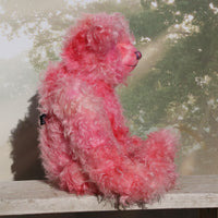 Maude stands 23 inches (59 cm) tall and is 17 inches (43 cm) sitting, she's a substantial lady.  Maude is a large, elegant teddy bear made from the most gorgeous long and fluffy pink mohair. She has a gentle personality, she loves to talk and to listen, she loves to hear all the gossip as she doesn't get out very much, so if you can tell her everything that's going on she can tell all the other bears, which will save you the job of telling all the bears individually. 