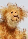 Milo is made from a sumptuous, long, very dense, soft and twirly, brown tipped gold mohair. Milo has beautiful hand painted, twinkling, glass eyes with hand coloured eyelids, a splendid nose embroidered from individual threads that tie in with his colours and a happy, hopeful expression, the sort of expression that seems to be asking for a big hug (or it could be cake).