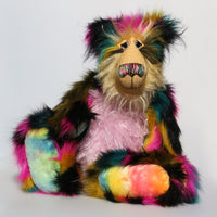 Milton is a very shaggy, wild and colourful, one of a kind, artist teddy bear by Barbara-Ann Bears, he stands 19 inches (48 cm) tall and is 15 inches (38 cm) sitting. Milton is  made from a black magenta, mustard and cyan dense faux fur and very long mohairs in soft golden blond (face), rose pink(tummy) and black (ears)