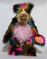 Milton is a very shaggy, wild and colourful, one of a kind, artist teddy bear by Barbara-Ann Bears, he stands 19 inches (48 cm) tall and is 15 inches (38 cm) sitting. Milton is  made from a black magenta, mustard and cyan dense faux fur and very long mohairs in soft golden blond (face), rose pink(tummy) and black (ears)