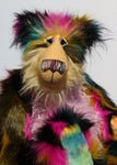 Milton is a very shaggy, wild and colourful, one of a kind, artist teddy bear by Barbara-Ann Bears, he stands 19 inches (48 cm) tall and is 15 inches (38 cm) sitting. Milton is  made from a black magenta, mustard and cyan dense faux fur and very long mohairs in soft golden blond (face), rose pink(tummy) and black (ears)