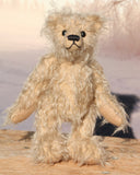 Morris is a very lovable and sweet, one of a kind, traditional artist teddy bear made from gorgeous shaggy mohair by Barbara-Ann Bears. Morris stands 8 inches (20 cm) tall and is 6 inches (15 cm) sitting. Morris is made from beige fluffy German mohair with beige wool felt paw pads and black vintage boot button eyes