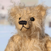 Morris is a very lovable and sweet, one of a kind, traditional artist teddy bear made from gorgeous shaggy mohair by Barbara-Ann Bears. Morris stands 8 inches (20 cm) tall and is 6 inches (15 cm) sitting. Morris is made from beige fluffy German mohair with beige wool felt paw pads and black vintage boot button eyes