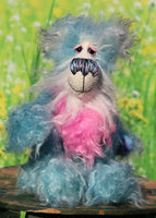 Murff is an extremely happy teddy bear, a comically joyful, one of a kind, hand-dyed mohair artist bear by Barbara-Ann Bears Murff stands 9 inches( 23 cm) tall and is 6.5 inches ( 16 cm) sitting. Murff is a wonderfully happy and enthusiastic teddy bear in blue and pink hand dyed mohair with a stonking nose and huge smile